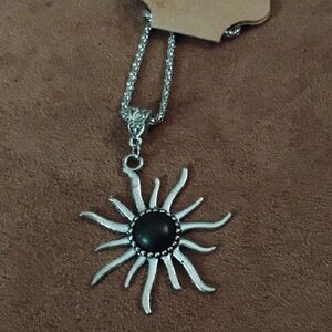 Radiant Silver Sunburst Necklace with Black Center